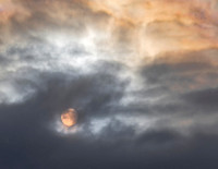 Rising sun shrouded in the clouds
